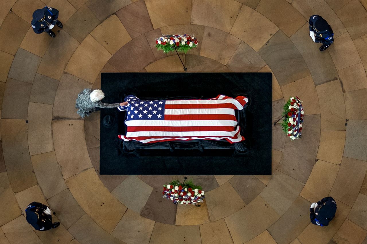 Landra Gould touches the casket of her husband, former US Sen. Harry Reid, as he <a href="https://www.cnn.com/2022/01/12/politics/harry-reid-lying-in-state/index.html" target="_blank">lies in state</a> in the US Capitol Rotunda on Wednesday, January 12. <a href="http://www.cnn.com/2021/12/28/politics/gallery/harry-reid/index.html" target="_blank">Reid,</a> a Democrat from Nevada who served 20 years in the Senate and led the Democratic Caucus for 12 of those years, died last month at the age of 82.
