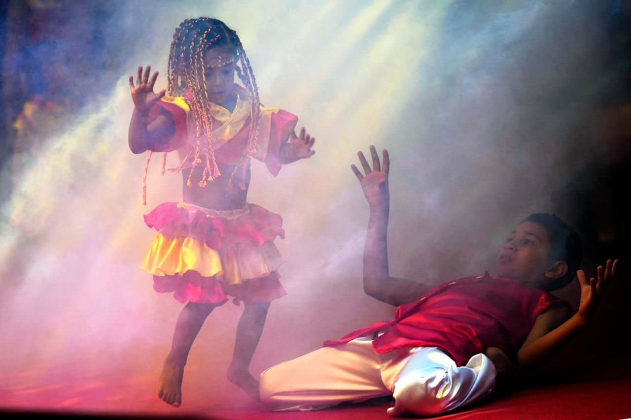 Members of the group Kamba Cua dance during Epiphany celebrations in Fernando de la Mora, Paraguay, on Saturday, January 8.
