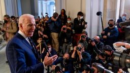 President Joe Biden speaks to members of the media as he leaves a meeting with the Senate Democratic Caucus to discuss voting rights and election integrity on Capitol Hill on January 13.
