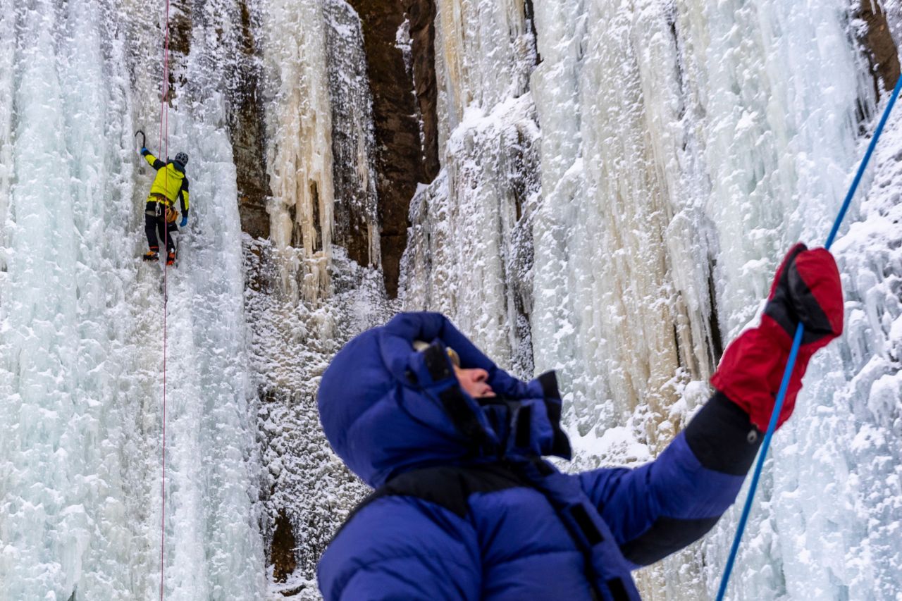 People climb on rock walls covered with ice pillars during the Sandstone Ice Climbing festival in Sandstone, Minnesota, on Friday, January 7.