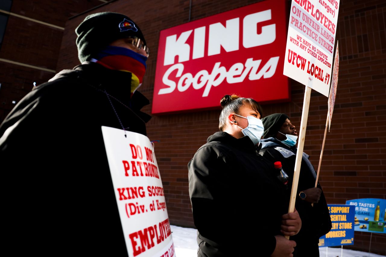 Grocery store workers walk a picket line in Denver on Wednesday, January 12. About 8,000 workers at 77 King Soopers and City Markets stores in the Denver area <a href="https://www.cnn.com/2022/01/13/business/king-soopers-strike/index.html" target="_blank">went on strike</a> after the union rejected what its company described as its best and final offer to replace a recently expired contract.