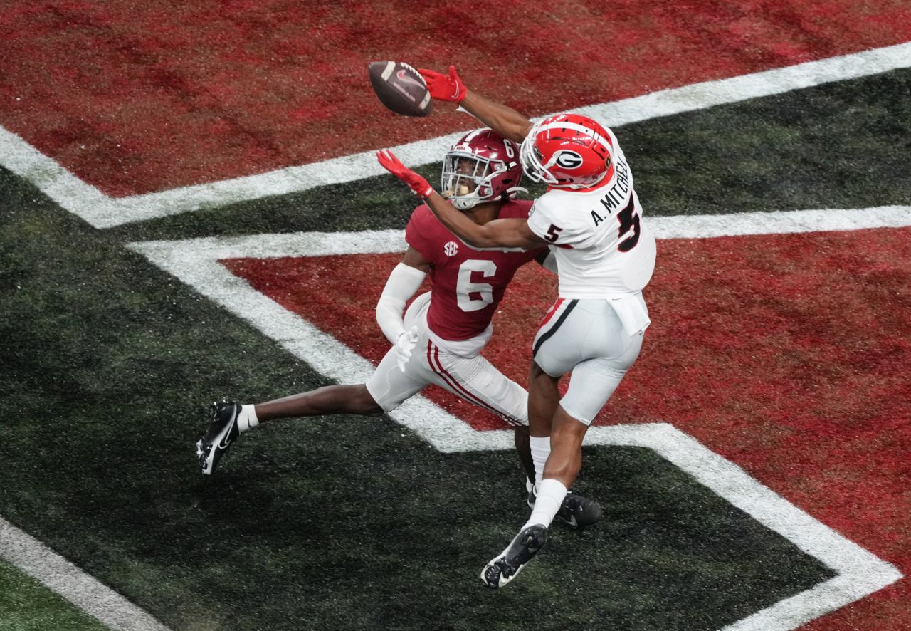 Georgia wide receiver Adonai Mitchell catches a 40-year touchdown pass over Alabama's Khyree Jackson in the fourth quarter of the national championship game on Monday, January 10. The touchdown gave Georgia a 19-18 lead it would not relinquish.
