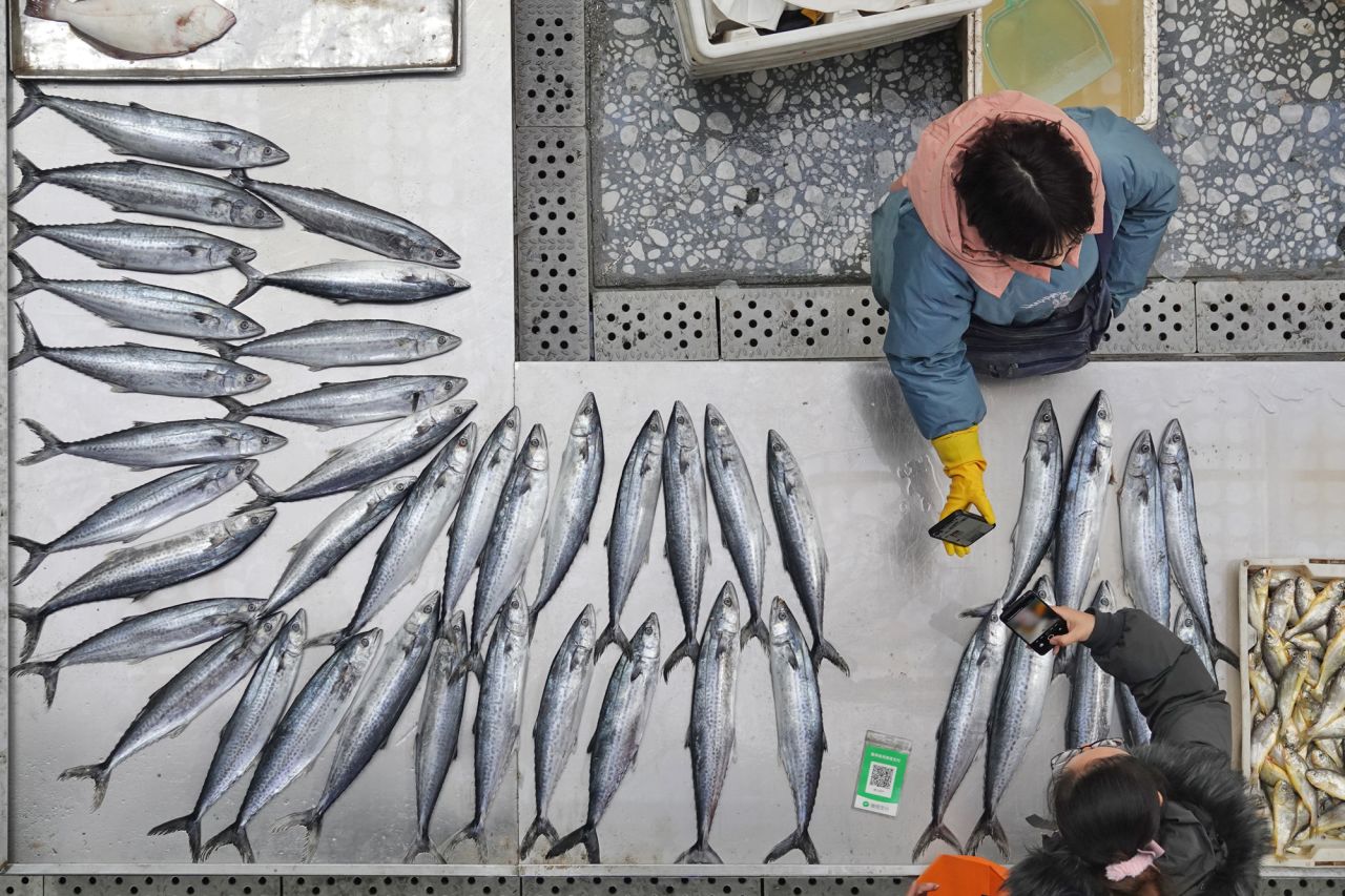 A vendor arranges seafood at an agricultural trade market in Yantai, China, on Wednesday, January 12.