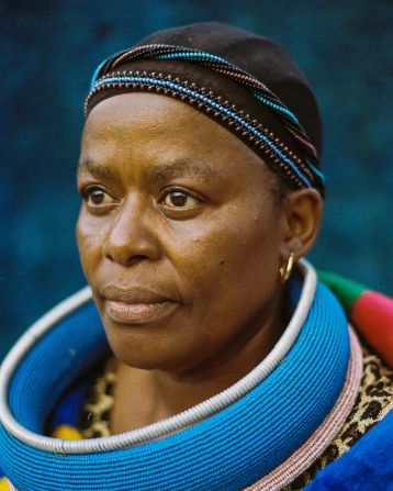 Pictured here is Masombuka's mother, Benzi Mahlangu-Masombuka, a Ndebele historian, wearing traditional beadwork around her head and neck.