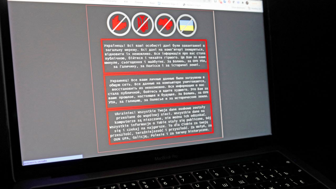 A laptop screen displays a warning message in Ukrainian, Russian and Polish, that appeared on the official website of the Ukrainian Foreign Ministry after a massive cyberattack, in this illustration taken January 14, 2022. 