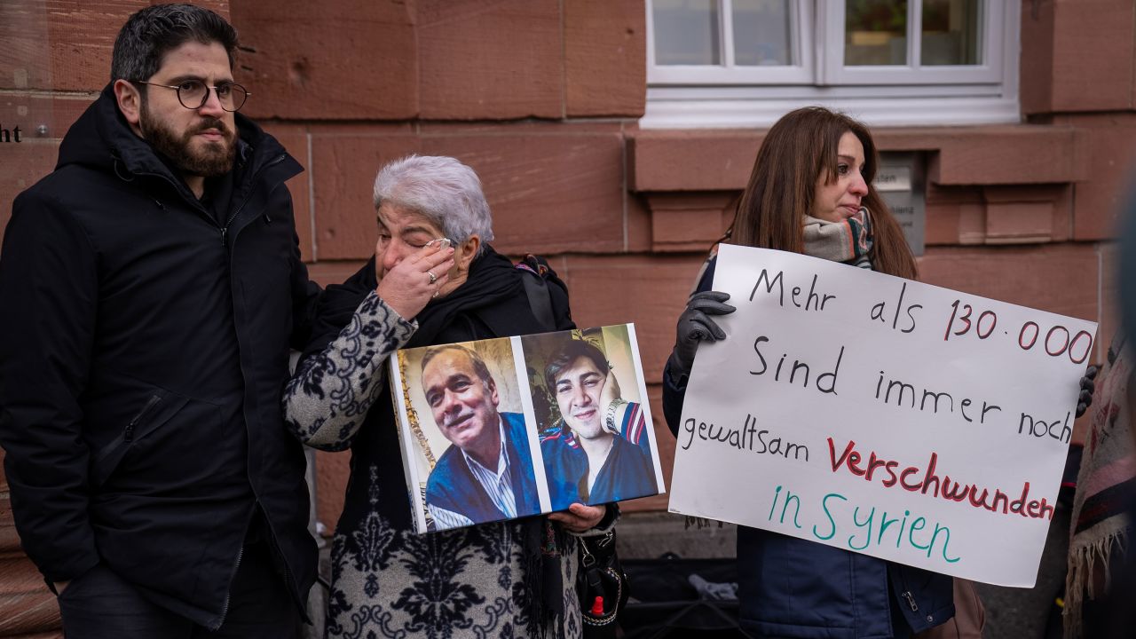 Fadwa Mahmoud, a leading activist whose son and husband were forcibly disappeared by the Assad regime, holds a vigil for her loved ones outside Koblenz court after the guilty verdict.