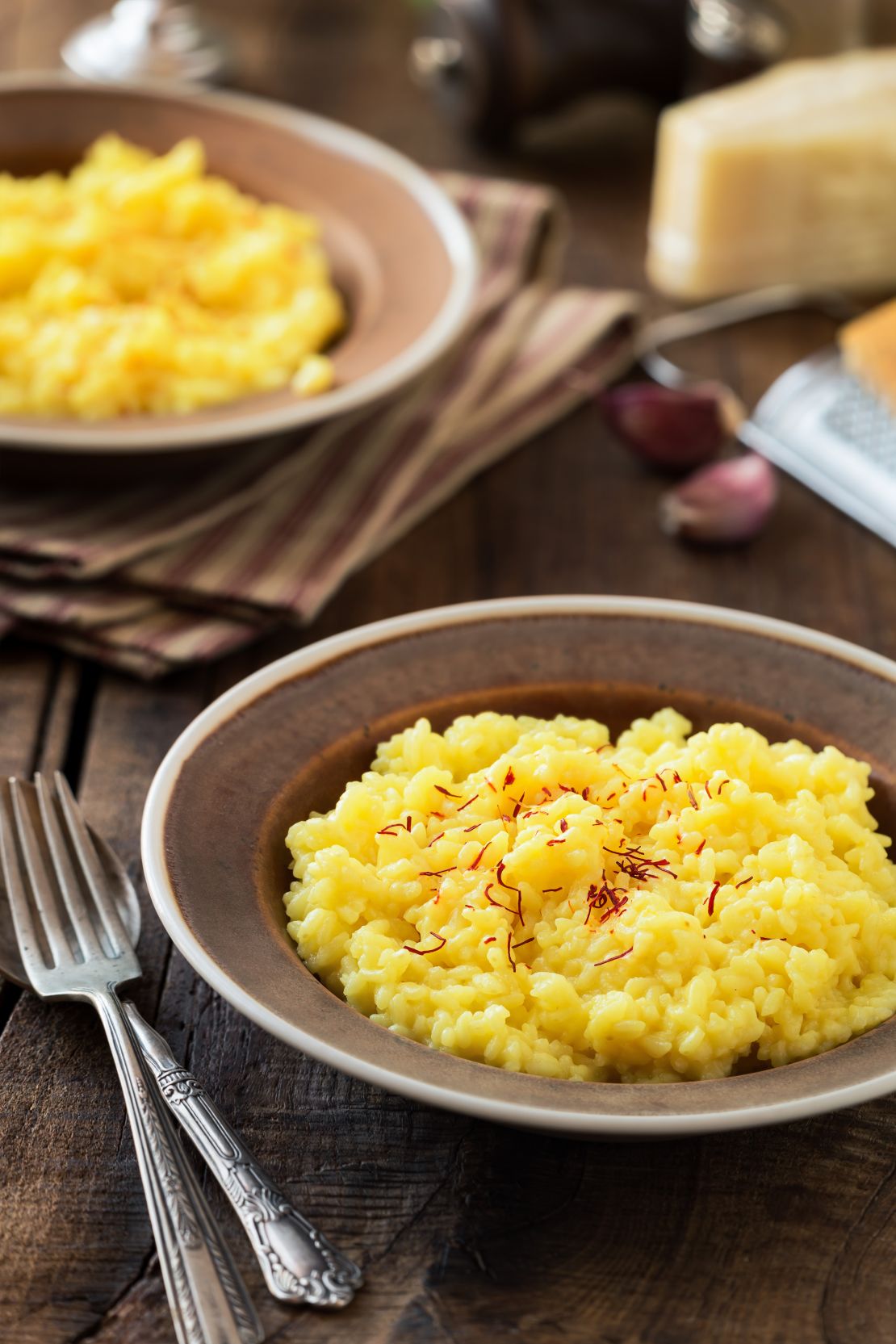 Italian risotto alla Milanese with saffron is shown.