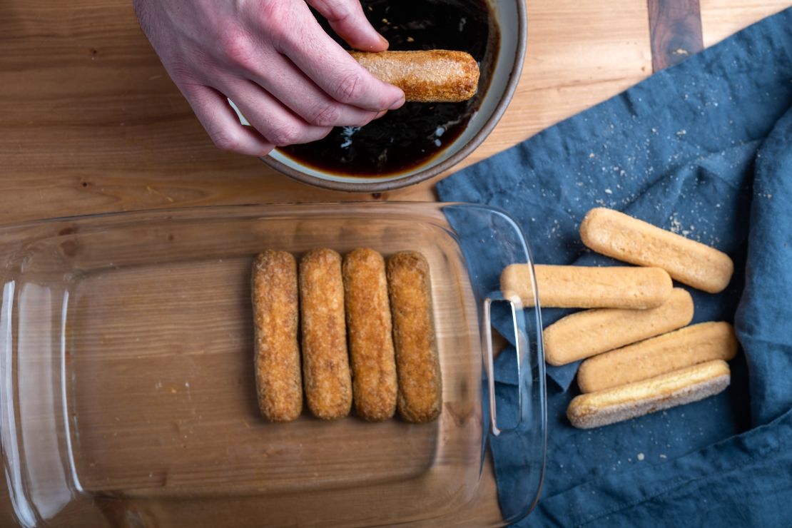 Each ladyfinger gets a soak in a mixture of espresso and rum until slightly softened.