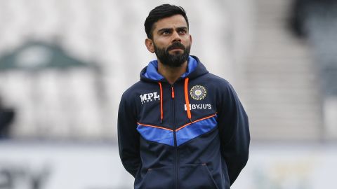 Virat Kohli looks on as the India team warms up ahead of the fourth day of the second Test cricket match between South Africa and India in Johannesburg on January 6, 2022. 