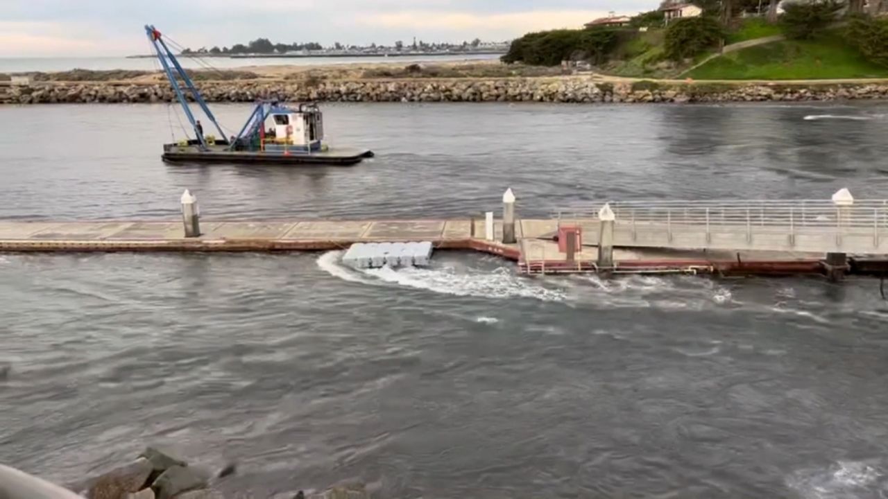 High tide comes into a harbor in Santa Cruz, California, seen in this still image from a video obtained by CNN. The water quickly drained out, Brad Anderson -- the person that provided the video -- said.