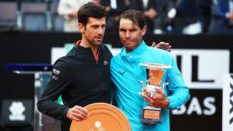 ROME, ITALY - MAY 19: Rafael Nadal of Spain with his winners trophy and Novak Djokovic of Serbia with his runners up trophy after Nadal's three set victory in the men's final during day eight of the International BNL d'Italia at Foro Italico on May 19, 2019 in Rome, Italy. (Photo by Clive Brunskill/Getty Images)