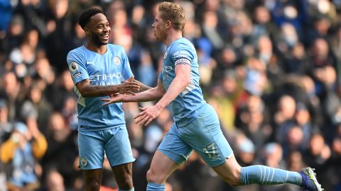 Kevin De Bruyne celebrates with teammate Raheem Sterling after scoring at the Etihad Stadium on January 15, 2022.