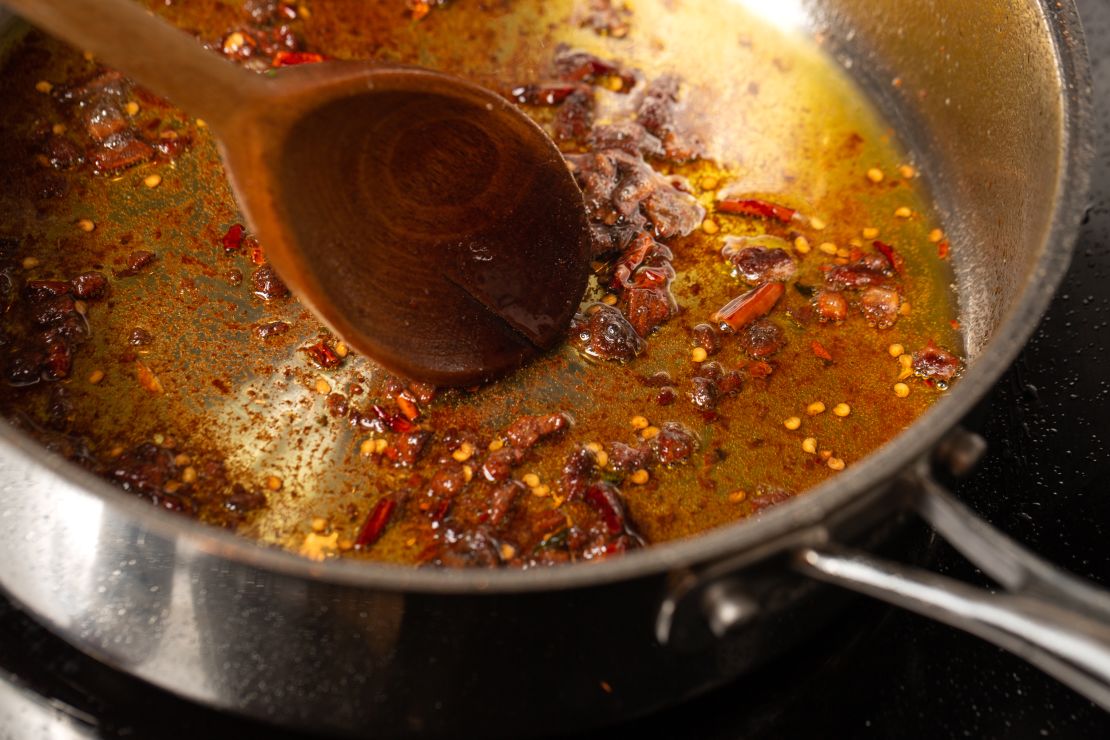 The pepperoncini infuse the oil while the anchovies get cooked down gently in the pan.