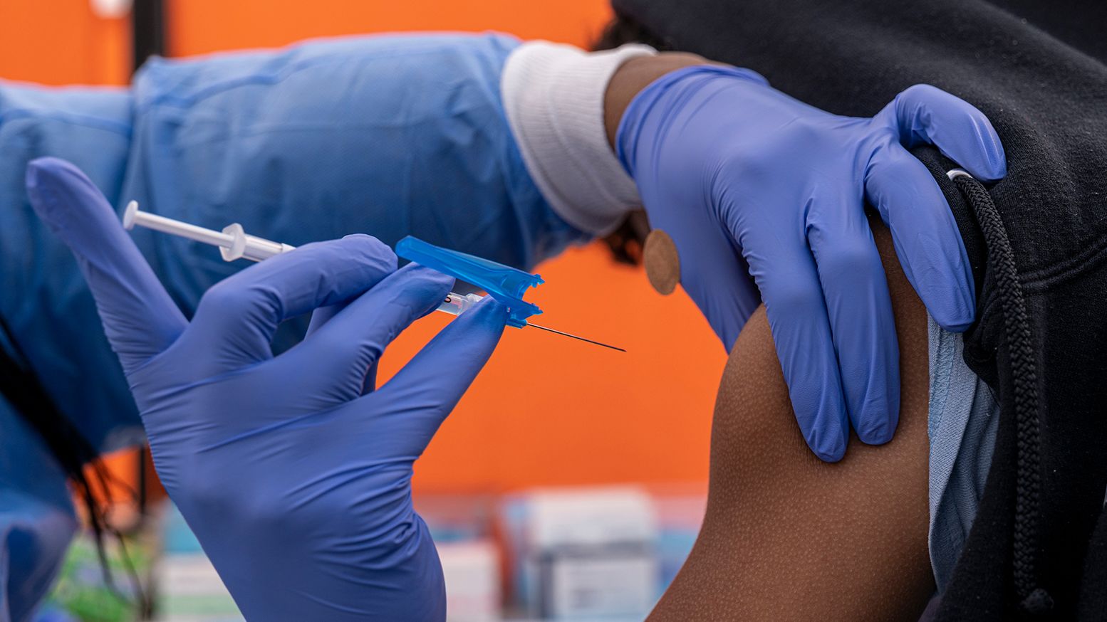 A health care worker administers a Pfizer-BioNTech Covid-19 vaccination to a child at a testing and vaccination site in San Francisco on January 10, 2022.