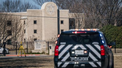 A police SUV sits outside the synagogue Sunday. 