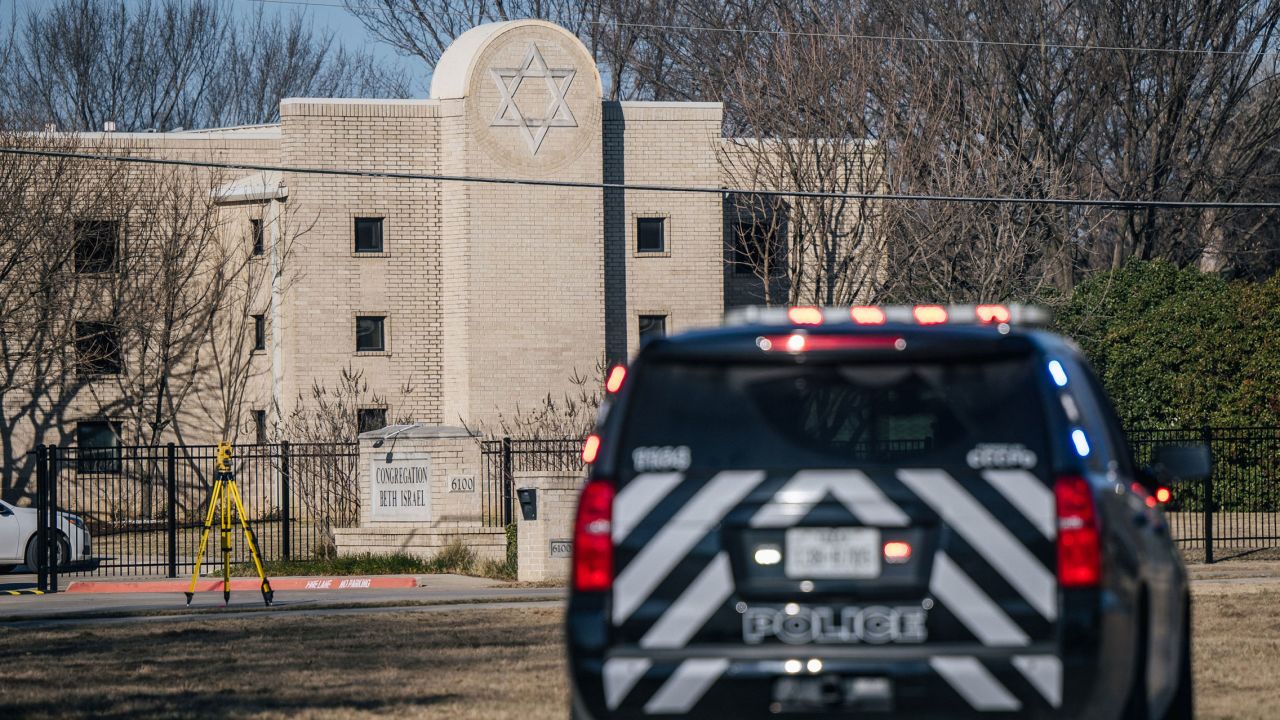 A law enforcement vehicle sits near the Congregation Beth Israel synagogue on Sunday, January 16, 2022, in Colleyville, Texas. 