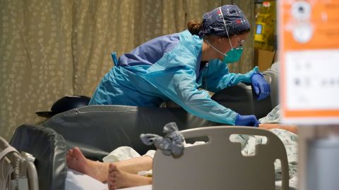 A nurse tends to a patient in the acute care unit of Harborview Medical Center in Seattle on January 14.