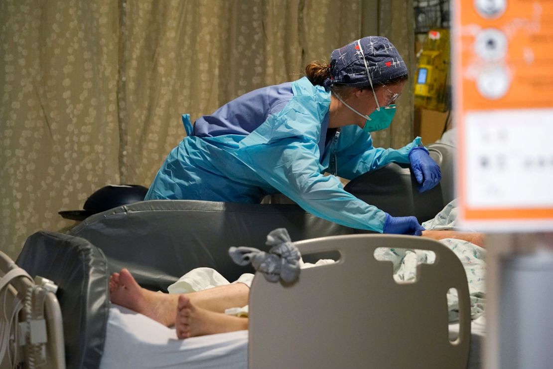 A nurse tends to a patient in the acute care unit of Harborview Medical Center in Seattle on January 14.