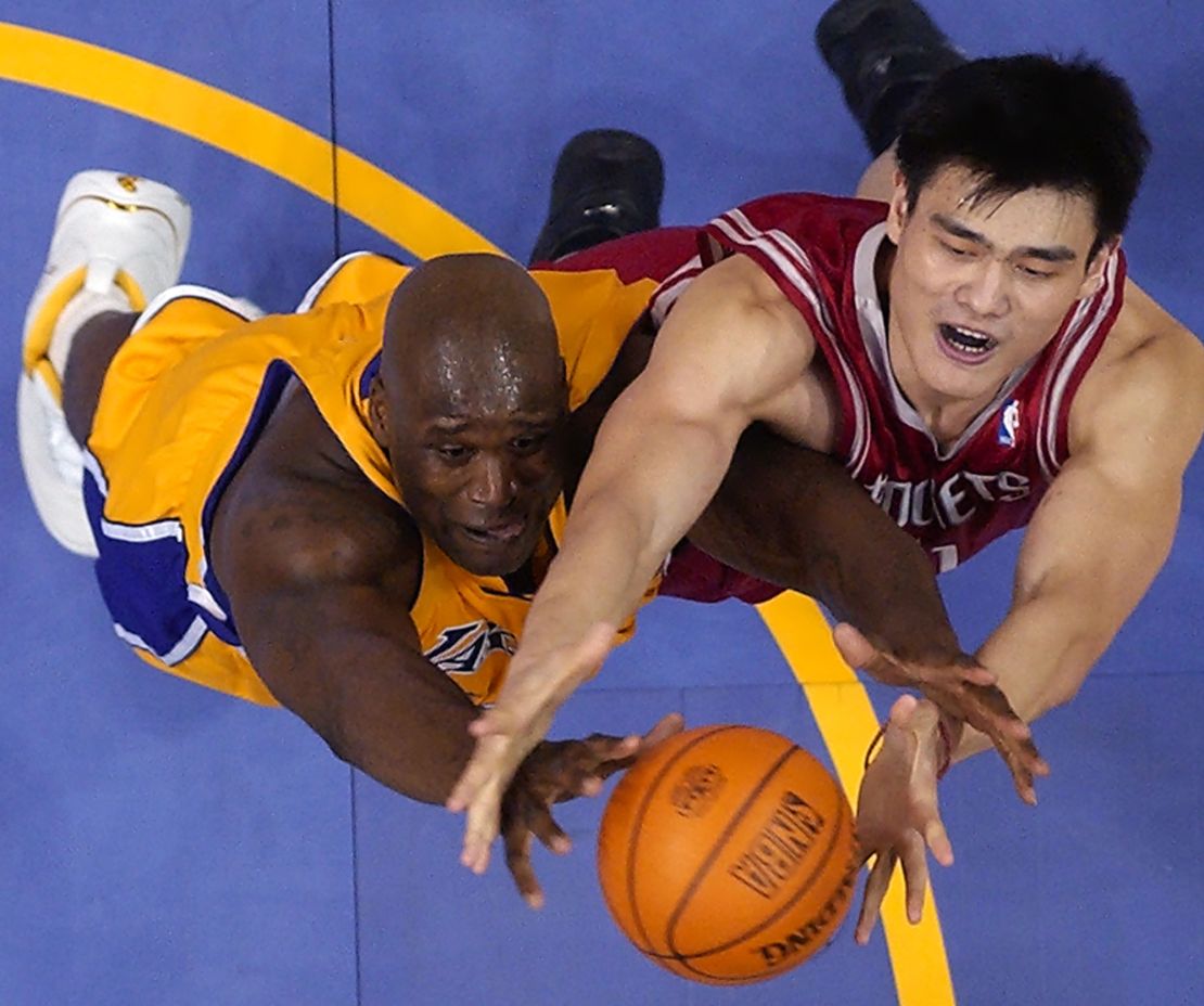 Yao goes after a rebound with Los Angeles Lakers' Shaquille O'Neal in 2004.