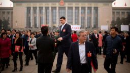Former NBA basketball player Yao Ming, center, a delegate to the Chinese People's Political Consultative Conference (CPPCC), leaves after a plenary session of the CPPCC at the Great Hall of the People in Beijing on March 14, 2018. 