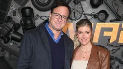 Bob Saget and Kelly Rizzo attend the red carpet premiere and party for Peacock's new comedy series "MacGruber" at California Science Center on December 08, 2021 in Los Angeles, California.