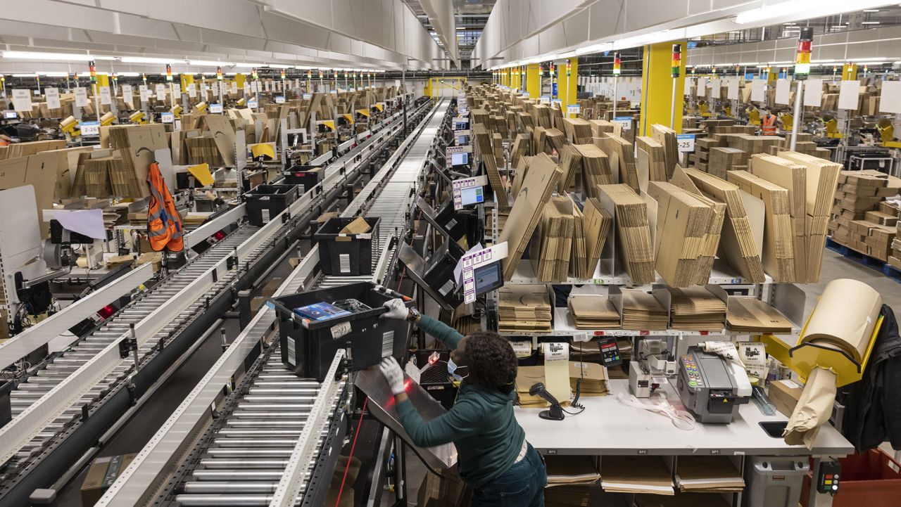 Goods are packaged at the Amazon fulfillment center on December 13, 2021 in London, England. 