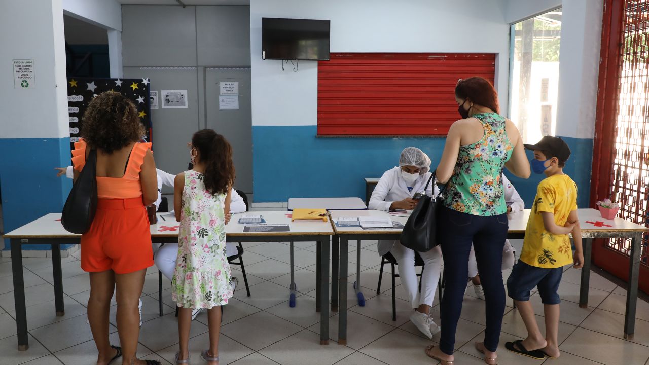 Families arrive at a Covid-19 vaccination center in Volta Redonda, Brazil, on Monday. 