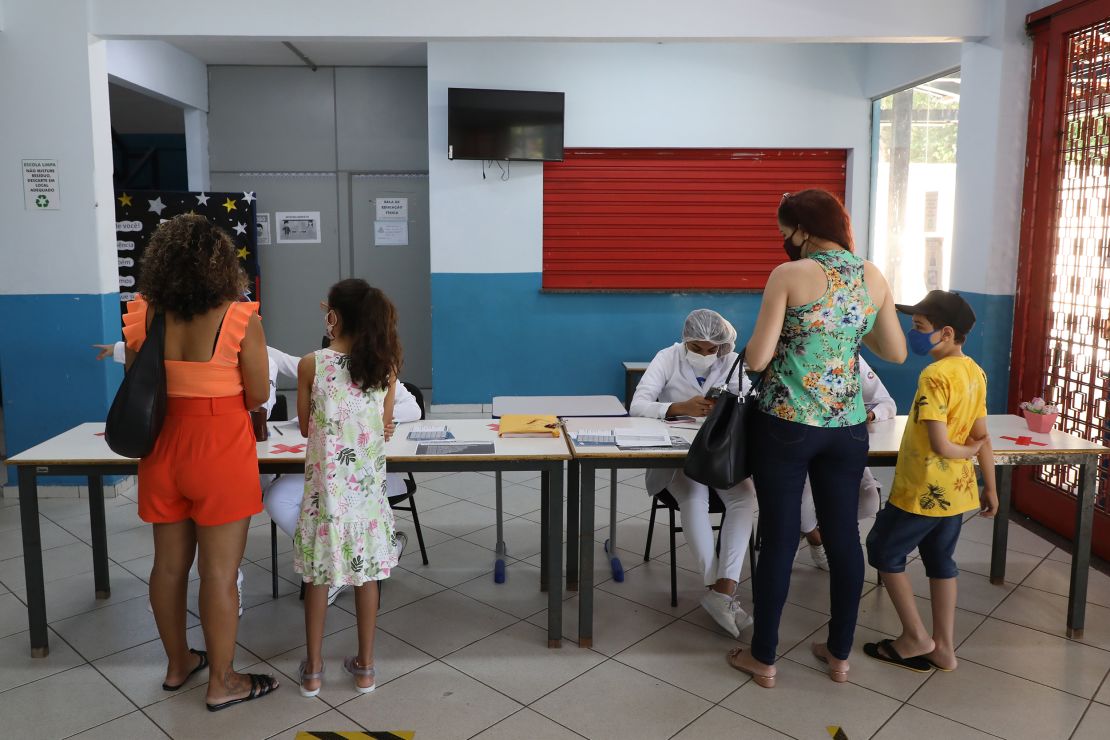 Families arrive at a Covid-19 vaccination center in Volta Redonda, Brazil, on Monday. 