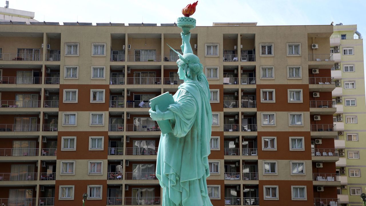 A mock-up of the Statue of Liberty is seen outside a tourist resort in the coastal city of Shengjin, where people evacuated from Afghanistan are sheltered. 