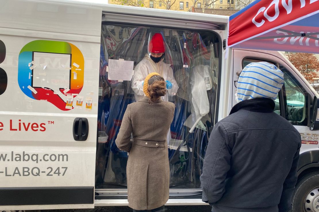 People stand in line at a LabQ testing van near Columbia University in New York in December. 