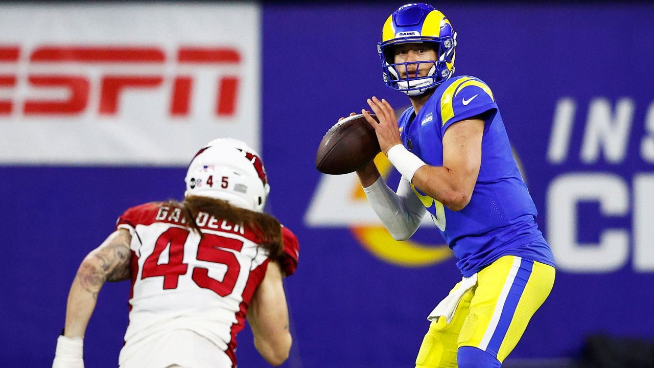 Stafford looks to pass against the Cardinals.