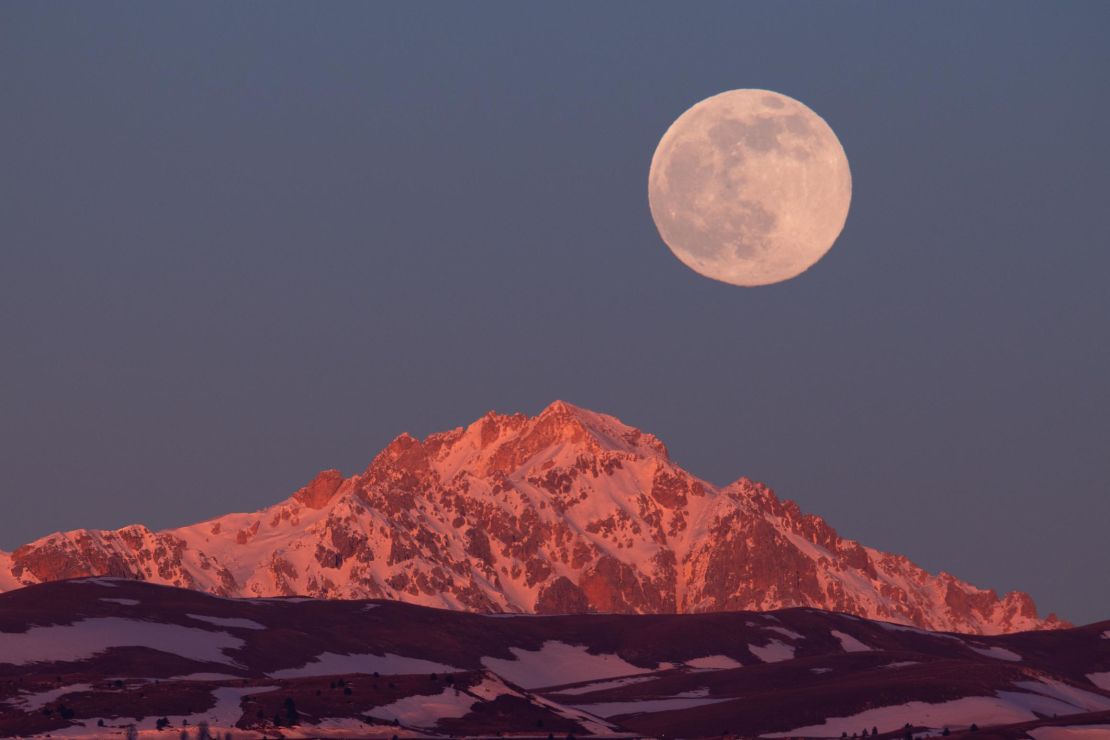 The full moon sets behind Monte Prena in Gran Sasso d'Italia National Park on January 17.