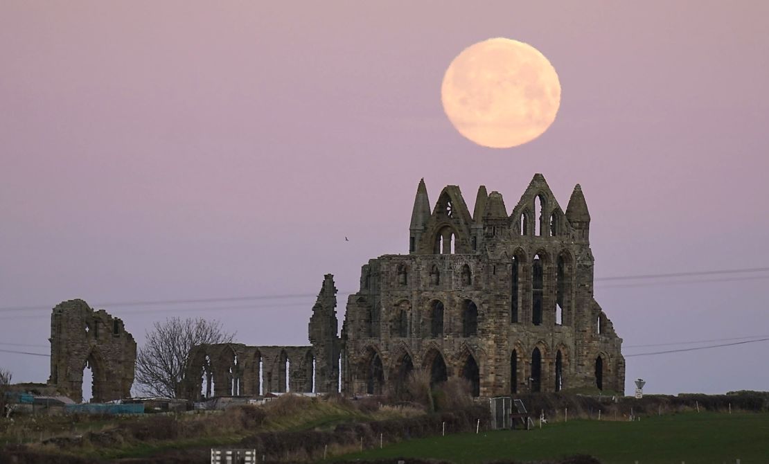 The moon sets behind Whitby Abbey in Yorkshire, England, on January 17.