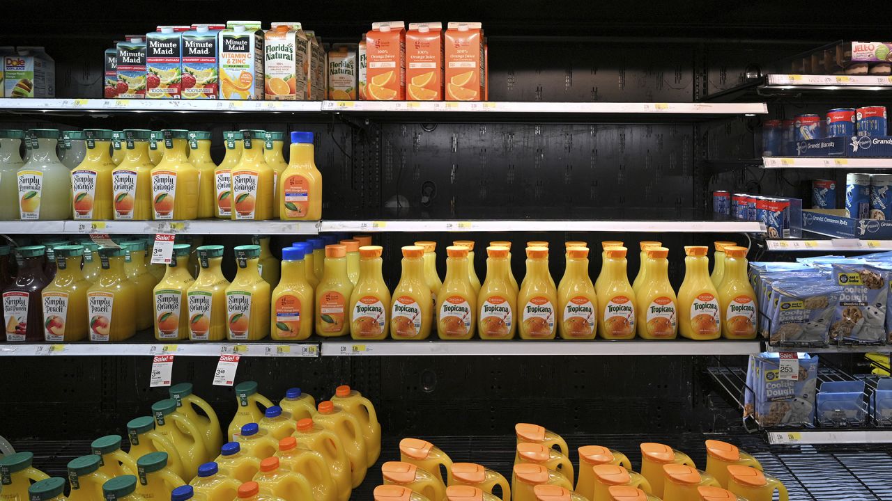 Half a shelf sits empty of orange juice at a Target store in the Queens borough of New York City, NY, on October 19, 2021.