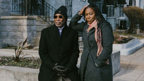 Larry Miller and his daughter, Laila Lacy, pose for a portrait in their old neighborhood at the corner of 57th and Catharine in West Philadelphia on Wednesday, January 12, 2022. 