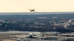 A passenger aircraft takes off from Ronald Reagan National Airport in Arlington, Virginia, on January 18, 2022, as seen from Washington, DC.