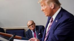 Rudy Giuliani, who went on to oversee a fake electors scheme, listens as the then-President speaks during a White House news conference in September 2020.