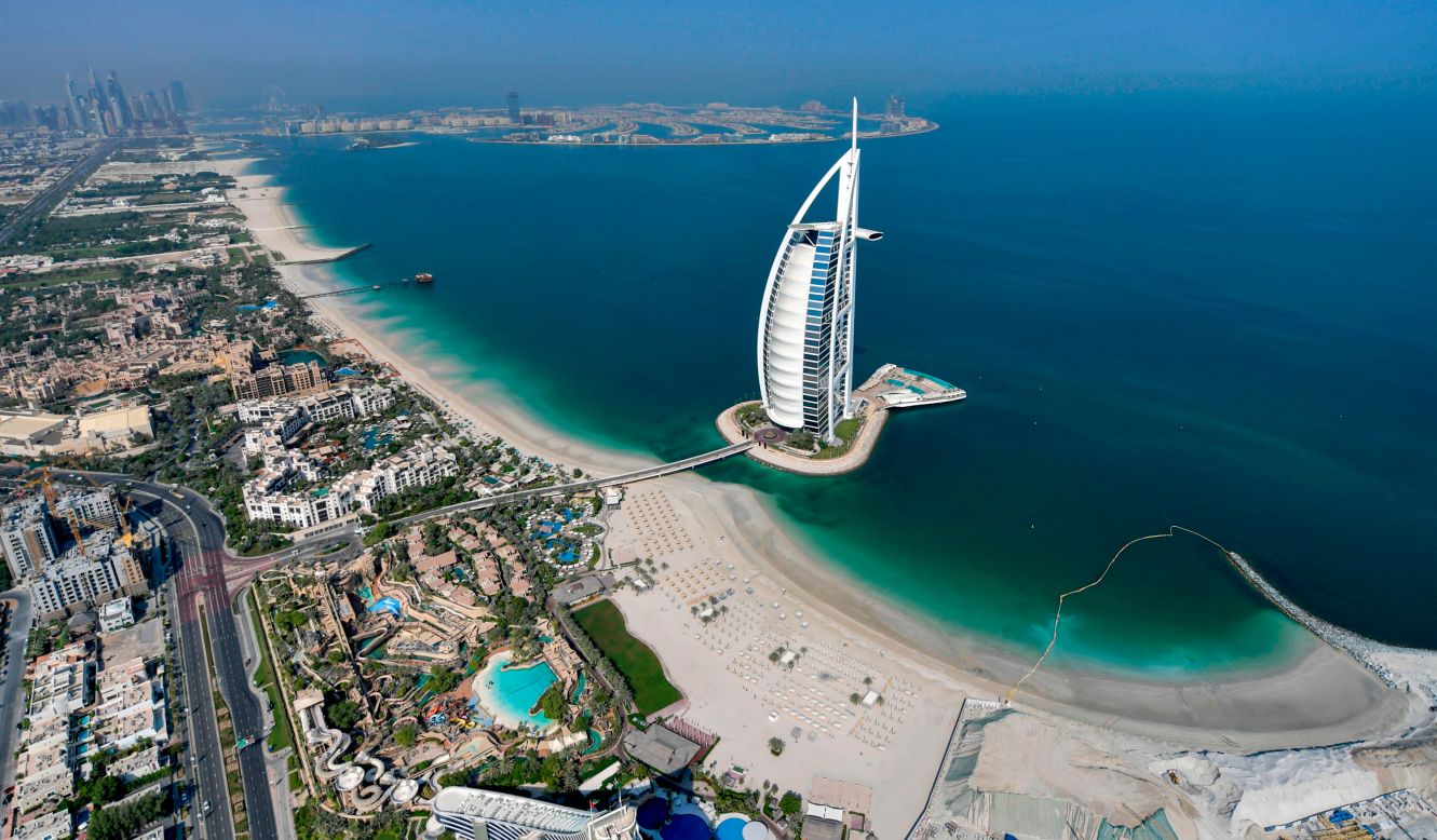 <strong>Dubai, United Arab Emirates (No. 1):</strong> Travel platform Tripadvisor is out with its annual list of the top 10 most popular destinations in the world, and for 2022, Dubai is the place to beat with its users. This 2020 photo shows an aerial view of the luxurious Burj al-Arab hotel. Click through the gallery to see the other nine most popular places: