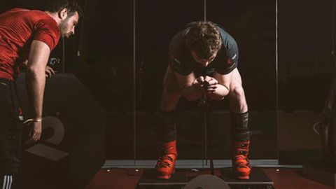 Farrell doing isometric 'squats' in speed ski position.