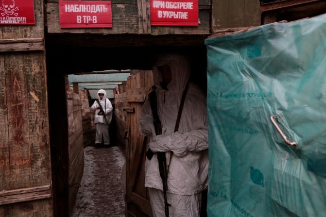 Servicemen take their position in a trench at the line of separation near Yasne village, south west of Donetsk in eastern Ukraine on Friday January 14.