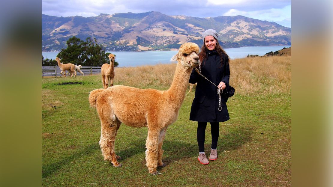 "I often described my bedbound state to friends as feeling like a puppy looking out the window as people played outside," says Ettenberg, seen here visiting an alpaca farm in Akaroa, New Zealand in 2014.