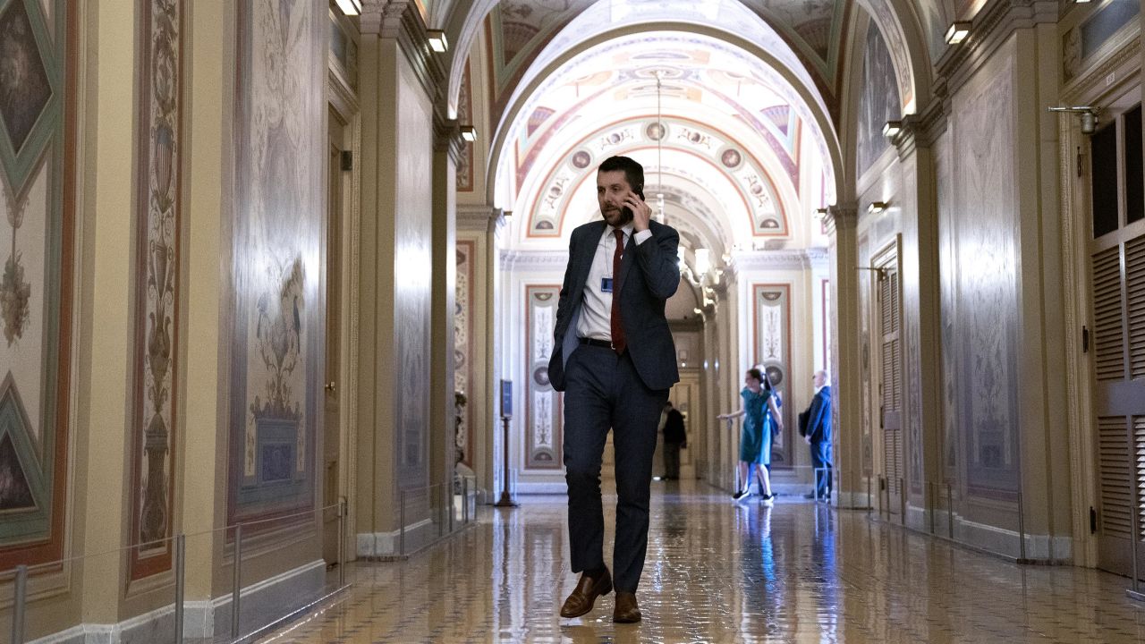 Brian Deese, director of the National Economic Council, speaks on the phone during a bipartisan infrastructure meeting at the Capitol on June 23, 2021. 