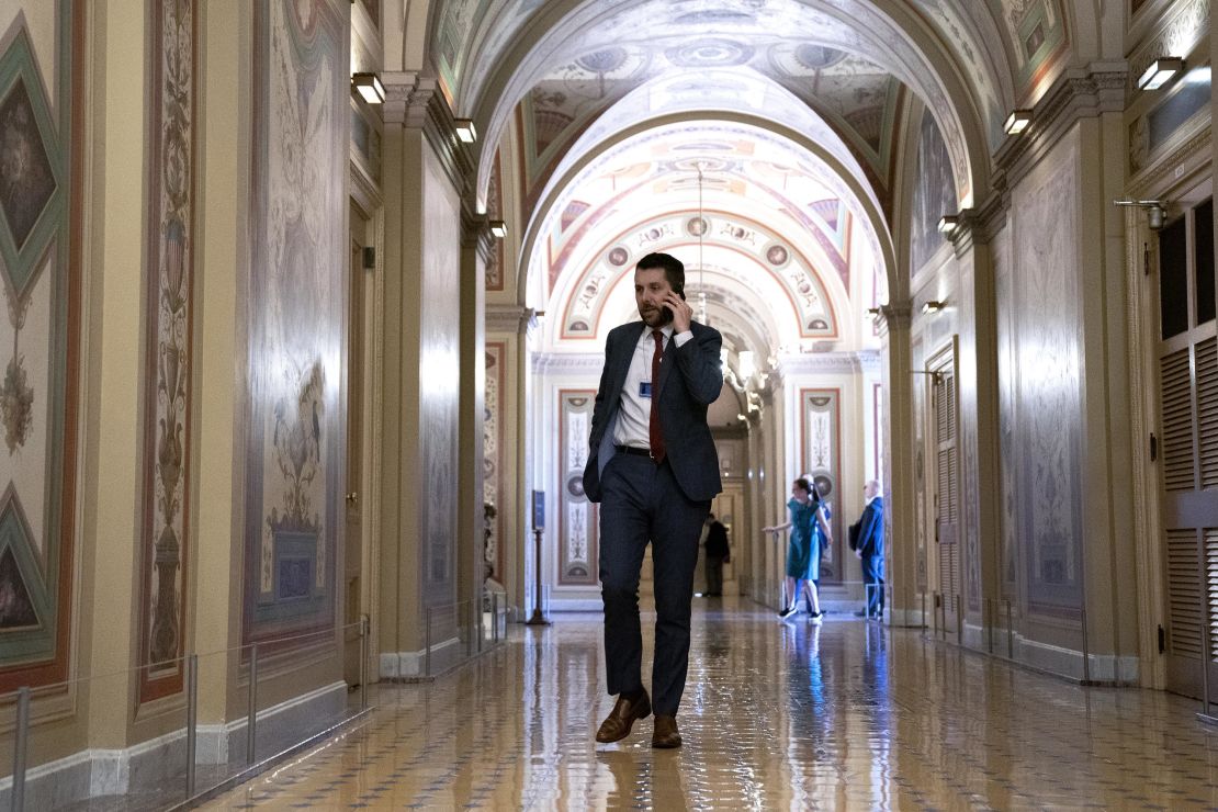 Brian Deese, director of the National Economic Council, speaks on the phone during a bipartisan infrastructure meeting at the Capitol on June 23, 2021. 