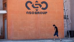 FILE - A logo adorns a wall on a branch of the Israeli NSO Group company, near the southern Israeli town of Sapir, Aug. 24, 2021. The third-largest group in the European Parliament has called for the establishment of a committee to investigate abuses by European Union governments with powerful spyware produced by Israel's NSO Group. Renew Europe, a liberal political grouping, said Wednesday, Jan. 12, 2022 that the use of the software to break into the phones of government critics is "undermining democracy." (AP Photo/Sebastian Scheiner, File)