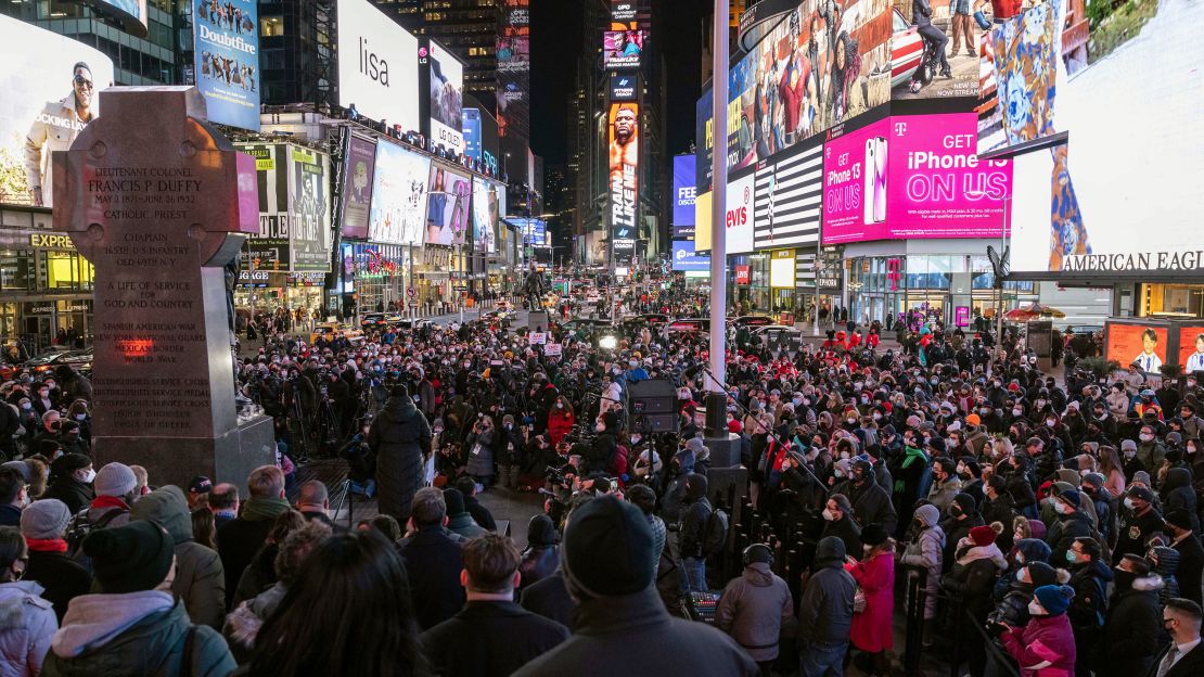 People gathered for a candlelight vigil in honor of Michelle Alyssa Go on Tuesday in Times Square.