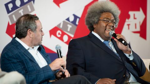 Elie Mystal, right, speaks during a panel about impeachment at the Politicon convention on October 27, 2019, in Nashville.