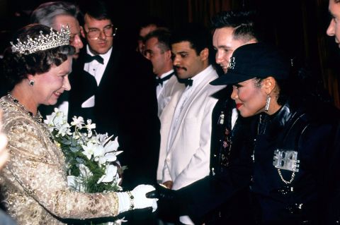 Queen Elizabeth II meets singer Janet Jackson in 1989 at the Royal Variety Performance at the London Palladium.
