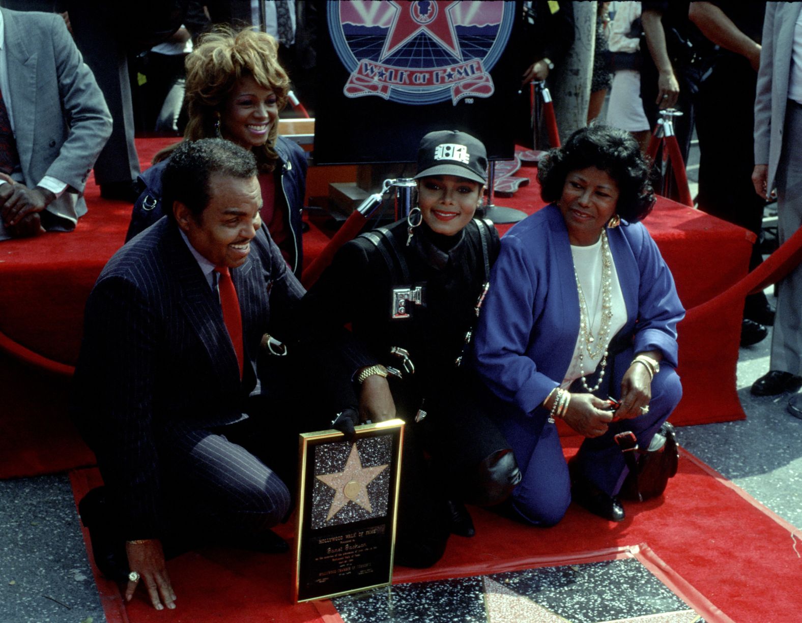 Janet Jackson, center, receives a star on the Hollywood Walk of Fame with her parents, Joe and Katherine Jackson, in 1990.