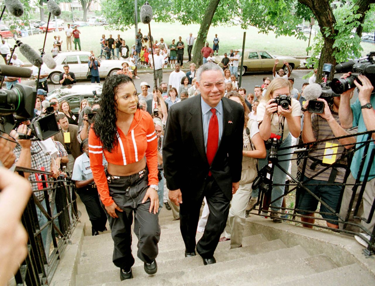 Colin Powell and Janet Jackson visit an at-risk neighborhood in Washington, D.C. to promote the organization "America's Promise" on July 7, 1998. Powell, the former Secretary of State, died in October 2021 at age 84. 