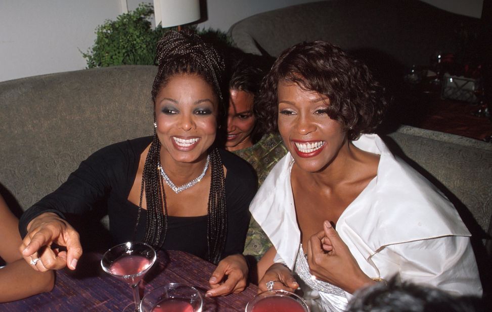 Janet Jackson and Whitney Houston attend the 71st annual Academy Awards' Elton John AIDS Foundation Party in Los Angeles in 1999.